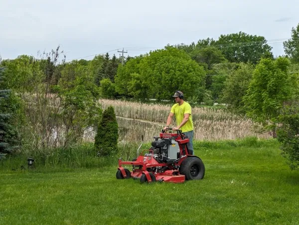 Leo cutting a lawn in lino lakes MN